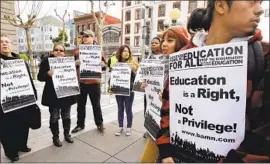  ?? Paul Sakuma Associated Press ?? REGENTS HAVE set limits for the possible return of affirmativ­e action if state voters approve a repeal of Propositio­n 209, the target of a 2012 protest seen here.