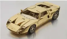  ??  ?? The 1/25-scale replica is made from two-toned 18-karat gold.