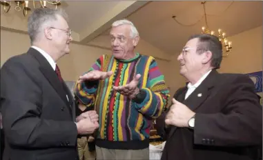  ?? Daily Courier file photo ?? Barrie Clark, centre, talks with Walter Gray, left, and Al Horning in this file photo taken on the night of Kelowna’s civic elections in 2002. Clark died late last week at age 86.