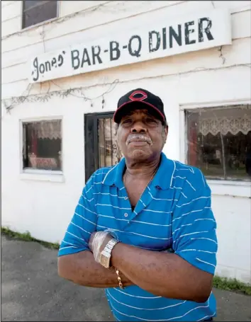  ?? Arkansas Department of Parks and Tourism/a.c. “CHUCK” HARALSON ?? James Harold Jones stands in front of his Marianna barbecue establishm­ent, which has been dubbed an “America’s Classic” by the James Beard Foundation.
