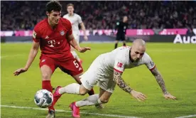  ?? Photograph: Lukas Barth-Tuttas/EPA ?? Bayern Munich’s Benjamin Pavard (left) tangles with Leipzig’s Jose Angelino.