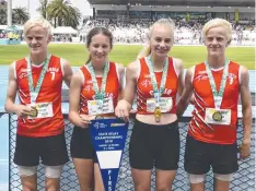  ??  ?? Sam Warelow, Isabella Grbin, Delainey Hill and Jack Warelow after winning a state gold in the 4x200m relay.