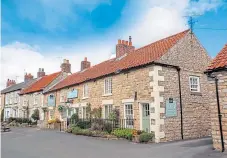  ?? ?? ● The Fox & Hounds in Sinnington, from left: The Parr bedroom; the spacious bathroom; the delightful dining room; and the exterior of the
18th-Century inn