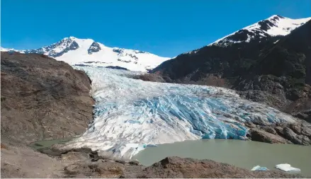  ?? BECKY BOHRER/AP 2022 ?? Chunks of ice float on a lake near the Mendenhall Glacier in Juneau, Alaska. A new study shows a dire prediction for the world’s glaciers.