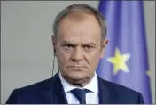  ?? EBRAHIM NOROOZI — THE ASSOCIATED PRESS ?? Poland's Prime Minister Donald Tusk listens to the media in Berlin, Germany, Friday. German Chancellor Olaf Scholz, France's President Emmanuel Macron and Poland's Prime Minister Donald Tusk meet in Berlin for the so-called Weimar Triangle talks.
