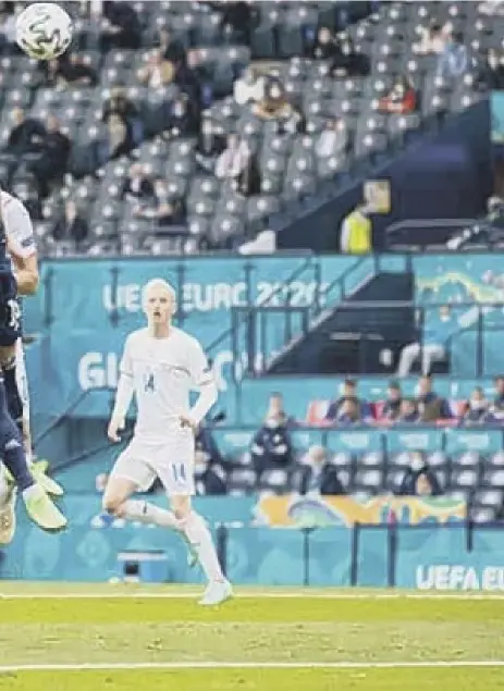  ??  ?? 2 Czech Republic striker Patrik Schick rises above Grant Hanley to head home to make it 1-0 shortly before half time. The Bayer Leverkusen striker added an audacious second to leave the Scots with a mountain to climb if they are to progress to the knockout phase of the tournament