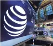  ?? RICHARD DREW, AP ?? AT&T shares slipped 1.7% to close at $36.86 on Monday, while Time Warner’s shares fell 3.1% to close at $86.74.