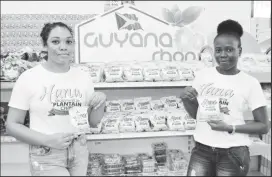  ??  ?? GMC employees,marketing officer Lisa Litira and Pro Shevon Nedd display a new product