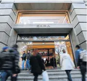  ?? /Reuters ?? Winter wonders: People enter a Zara store, a brand of Inditex, in