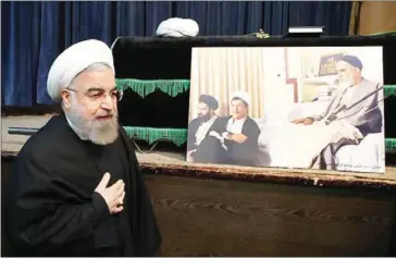  ?? IRANIAN PRESIDENCY/AFP ?? Iranian President Hassan Rouhani prays next to the coffin of former Iranian President Akbar Hashemi Rafsanjani during a mourning ceremony at the Jamaran mosque in Tehran yesterday.