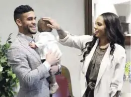  ??  ?? KANSAS CITY: In this photo provided by Sporting Kansas City and taken March 16, 2017, from left to right, Dom Dwyer, infant son Cassius and wife Sydney Leroux gather for Dwyers naturaliza­tion ceremony at Charles Evans Whittaker Courthouse in Kansas...