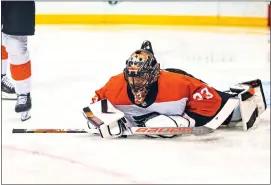  ?? PETER K. AFRIYIE — THE ASSOCIATED PRESS ?? Philadelph­ia Flyers’ Samuel Ersson lies on the ice after making a save against the New York Rangers during the second period of an NHL hockey game Tuesday, March 26, 2024 in New York.