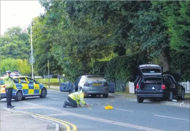  ?? Picture: Andy Clark ?? Police officers at work at the scene of the collision in Faversham Road