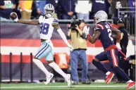 ?? Maddie Meyer / Getty Images ?? Cowboys receiver CeeDee Lamb celebrates after catching the winning touchdown against the Patriots’ Jalen Mills in overtime on Sunday in Foxborough, Mass.