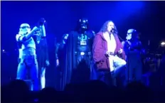 ??  ?? Weird Al Yankovic sings his song “The Saga Begins” while Star Wars characters dance in the background.