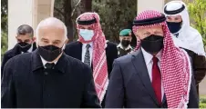  ?? — AFP photo (centre) ?? King Abdullah (right), Prince Hassan (left) and Prince Hamzah arriving at the Raghadan Palace in the capital Jordan.