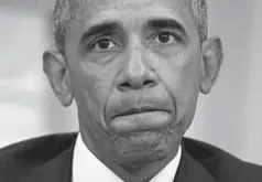  ?? Associated Press ?? President Barack Obama pauses Monday while speaking to members of the media in the Oval Office after getting briefed on the FBI investigat­ion of the Sunday shooting at a nightclub in Orlando, Fla.