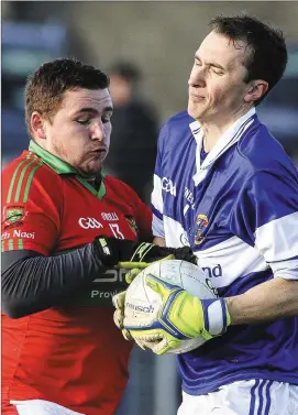  ??  ?? Rathnew’s Mark Doyle puts pressure on St Vincent’s goalkeeper Michael Savage during the Leinster Senior Club football championsh­ip game in Joule Park, Aughrim.