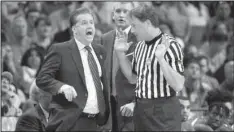  ?? AP/MARK HUMPHREY ?? Referee John Higgins (right), shown with Kentucky Coach John Calipari during Sunday’s NCAA South Regional final against North Carolina, has received nonstop phone calls and even death threats from Kentucky fans since the game.