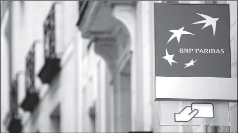  ?? REUTERS ?? The logo of BNP Paribas bank is shown in an office building in Nantes.