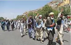  ?? Reuters ?? Afghan peace marchers arrive in Kabul, Afghanista­n, yesterday after their 700-km trek from Lashkar Gah.