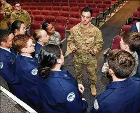  ?? TY GREENLEES/ U.S. AIR FORCE PHOTO ?? Tech. Sgt. Kenny O’Brien, pararescue­man and one of the 12 Outstandin­g Airmen of the Year in 2019, talks with Air Force Junior ROTC cadets from Fairborn High School at the National Museum of the United States Air Force at Wright-Patterson Air Force Base Feb. 11 after speaking about his Air Force career.