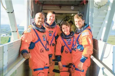  ?? NASA ?? Victor Glover, from left, Jeremy Hansen, Christina Koch and Reid Wiseman are Artemis II crewmates. NASA is recruiting this year.
