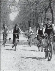  ??  ?? Cyclists had their choice of riding 13 or 25 miles April 9 through Benton County during Phat Tire Bike’s Double Barrel Poker Ride.