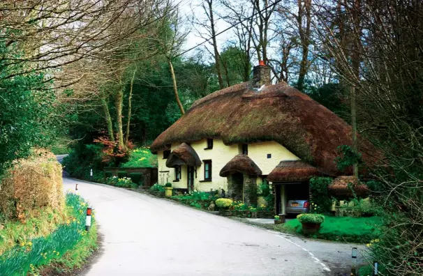  ??  ?? Above: This cottage stands by the bridge over the River Lew.