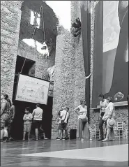  ?? AP/HERNAN MUNOZ ?? Visitors stand near the tomb of Salvador Dali inside the Dali Museum Theatre in Figueres, Spain. The site makes up one part of Spain’s “Dali Triangle.”