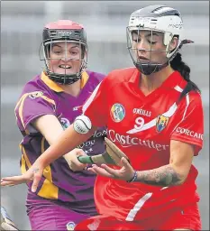  ??  ?? Shelley Kehoe battling it out with Cork midfielder Aisling Thompson.