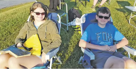  ?? COURTESY PHOTO ?? Grace Raiford and her brother, Ryan, keep an eye on things at last month's Luray Swim Fest.