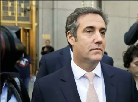  ?? SETH WENIG — THE ASSOCIATED PRESS FILE ?? In this file photo, Michael Cohen leaves federal court in New York. President Donald Trump’s former personal lawyer secretly recorded Trump discussing payments to a former Playboy model who said she had an affair with him, The New York Times reported Friday, July 20. The president’s current personal lawyer confirmed the conversati­on and said it showed Trump did nothing wrong, according to the Times.