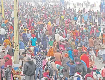  ?? — AFP photo ?? Hindu pilgrims crowd at the confluence of Ganges and the Bay of Bengal during the Gangasagar Mela on the occasion of Makar Sankranti, a day considered to be of great religious significan­ce in Hindu mythology, at Sagar Island, around 150kms south of Kolkata.