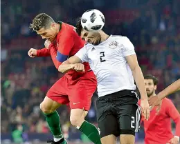  ?? — AFP ?? Portugal’s Cristiano Ronaldo (left) scores against Egypt at Letzigrund Stadium in Zurich on Friday. Portugal won 2-1.