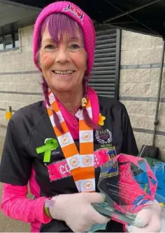  ??  ?? Collette O’Hagan after completing her 700th marathon in Antrim.