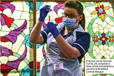  ??  ?? Practice nurse Hannah Currie, 25, prepares a dose of the AstraZenec­a vaccine at Bradford Central Mosque