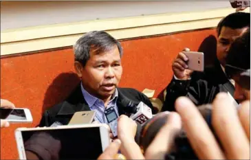  ?? PHA LINA ?? Yung Phanith, Oeut Ang’s lawyer, speaks to the press after his client was sentenced to life in prison yesterday in Phnom Penh.