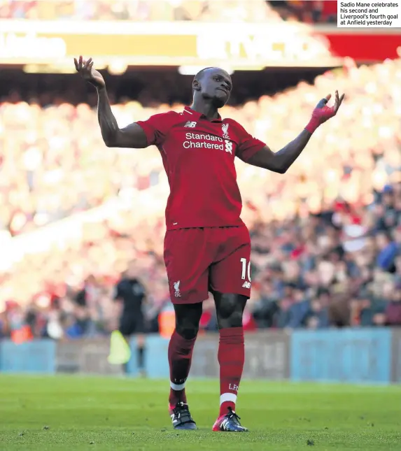  ??  ?? Sadio Mane celebrates his second and Liverpool’s fourth goal at Anfield yesterday