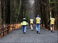  ?? TANIA BARRICKLO — DAILY FREEMAN ?? Employees of the New York City Department of Environmen­tal Protection maintain some distance between each other while walking along the Ashokan Rail Trail in Ulster County on Friday, March 20, 2020.