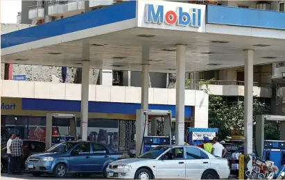  ?? (Mohamed Abd El Ghany/Reuters) ?? DRIVERS BUY gasoline at a gas station in Cairo yesterday. Government officials say short-term austerity under the IMF plan will free up more financing for infrastruc­ture and draw foreign investment to help create jobs and economic growth.