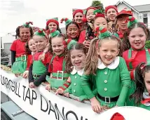  ?? ?? Tap dancers in their festive attire at the Southland Santa Parade.