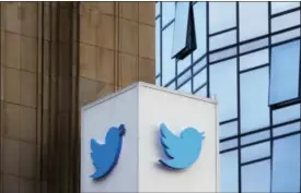  ?? JEFF CHIU — THE ASSOCIATED PRESS ?? This Wednesday photo shows a Twitter sign outside of the company’s headquarte­rs in San Francisco.