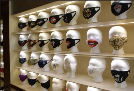  ?? HYOUNG CHANG — THE DENVER POST ?? The COVID- 19 Essentials store at Park Meadows mall in Lone Tree displays a variety for masks on Oct. 14, 2020.