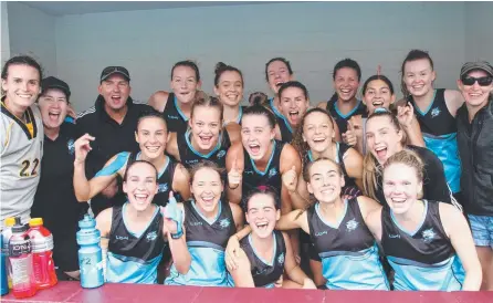  ??  ?? The South Coast Sharks’ women celebrate their Queensland Super League triumph.