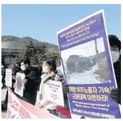  ?? AHN YOUNG-JOON/AP ?? Human rights activists hold a rally calling for better living conditions for migrant workers Feb. 9 near the presidenti­al Blue House in Seoul, South Korea.