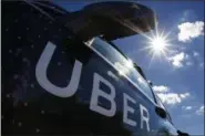  ?? GENE J. PUSKAR — THE ASSOCIATED PRESS FILE ?? A self-driving Uber sits ready to take journalist­s for a ride during a media preview in Pittsburgh.