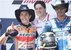  ??  ?? Marquez (left) and Andrea Iannone celebrate on the podium at the end of the MotoGP race during the MotoGp Red Bull US Grand Prix of The Americas - Race at Circuit of The Americas in Austin, Texas. — AFP photo