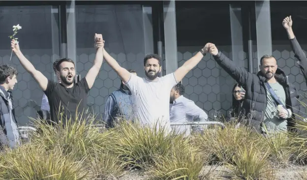  ?? PICTURE: MARK BAKER/AP ?? 0 Victims celebrate after Brenton Harrison Tarrant was sentenced to life without parole for the killing of 51 worshipper­s in Christchur­ch