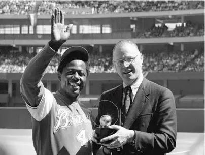  ?? AP FILE ?? Hank Aaron’s chase of the career home run record held then by Babe Ruth is one of baseball’s indelible memories from the 1970s.